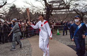 Tokyo Olympic torch staffer becomes event's first COVID-19 infection