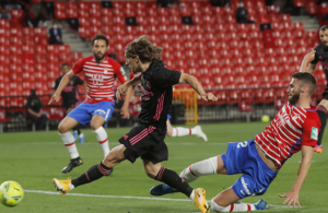 Real sink Granada to keep pressure on Atletico