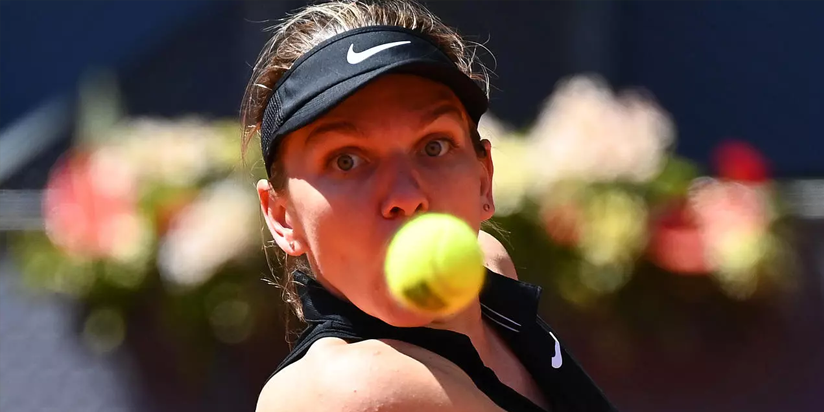 Halep knocked out of Madrid Open by Mertens