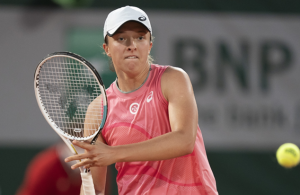 Swiatek holds off Kostyuk to reach last eight in Paris